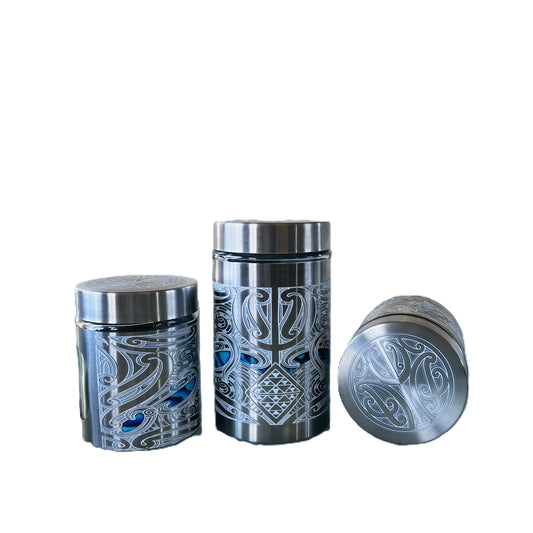 Three silver canisters with Māori design Labelled Ti, Kawhe, Huka -Back image
