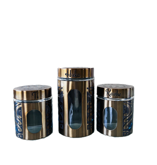 Three Gold canisters with Māori design Labelled Ti, Kawhe, Huka 